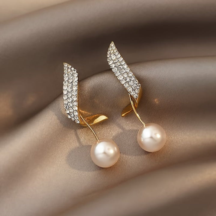 Boucles d'oreilles en perle avec plume en cristal