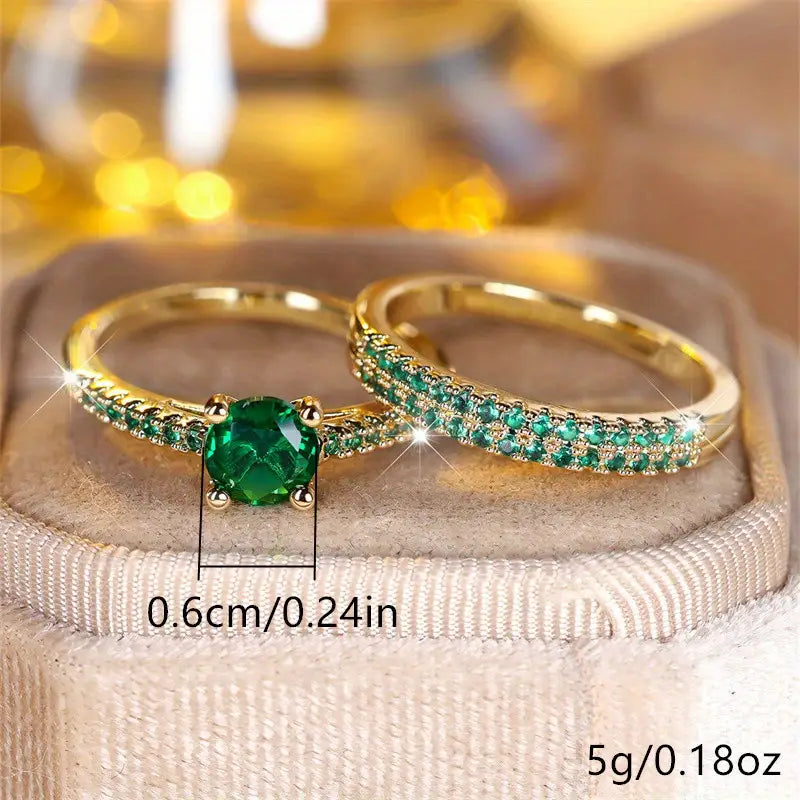 Set di due anelli con smeraldo in oro