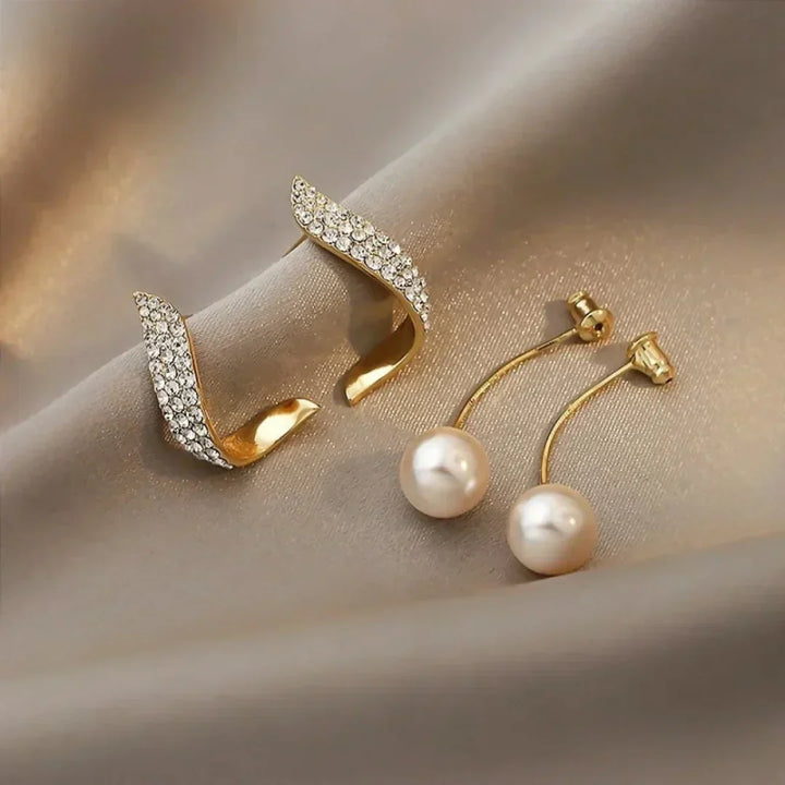 Boucles d'oreilles en perle avec plume en cristal