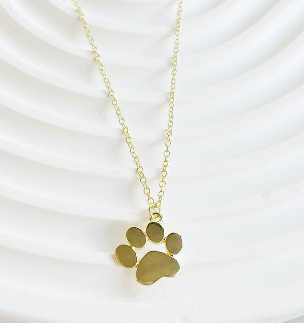 Collana con ciondolo a forma di zampa dorata