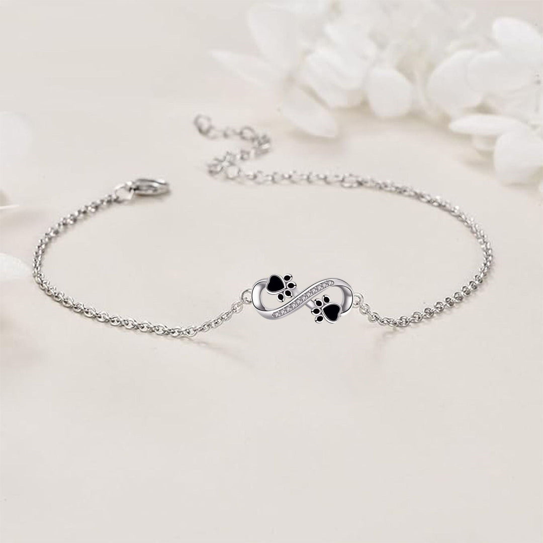 Bracelet avec symbole de l'infini, pendentif avec empreinte de patte et zircone