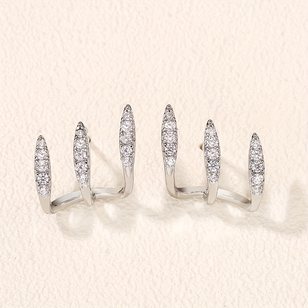 Elegante Ohrringe mit drei Krappen und Strass