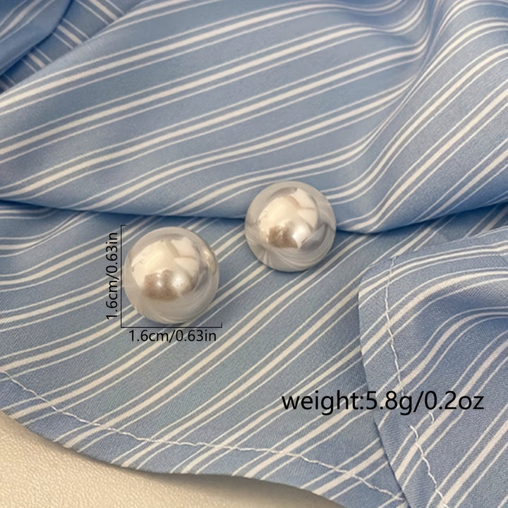 Les boucles d'oreilles dormeuses à perle statement