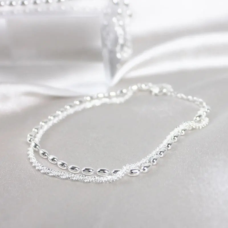 Elegante set di bracciali in argento con zirconi