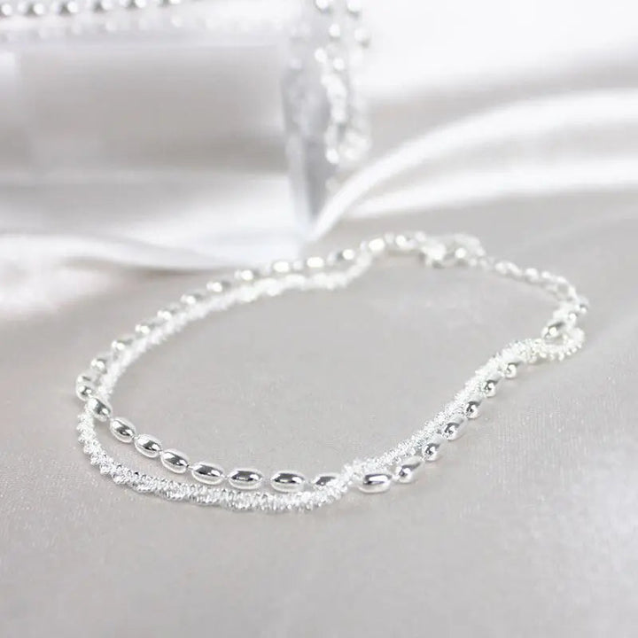 Elegante set di bracciali in argento con zirconi