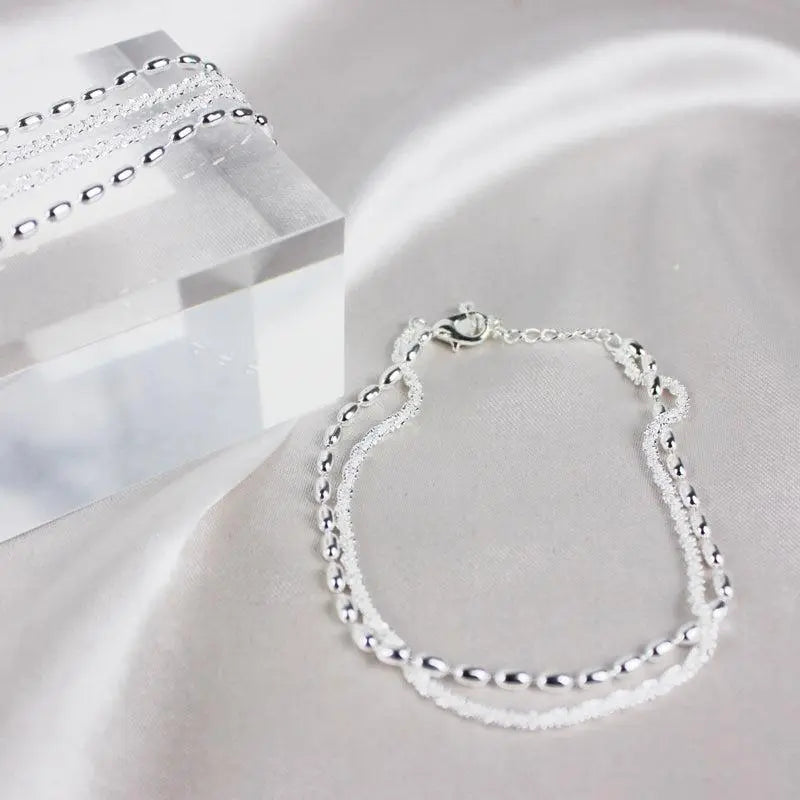 Elegante set di bracciali in argento con zirconi