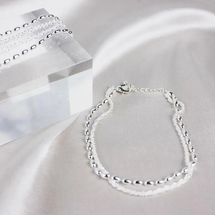 Elegante set di bracciali in argento con zirconi