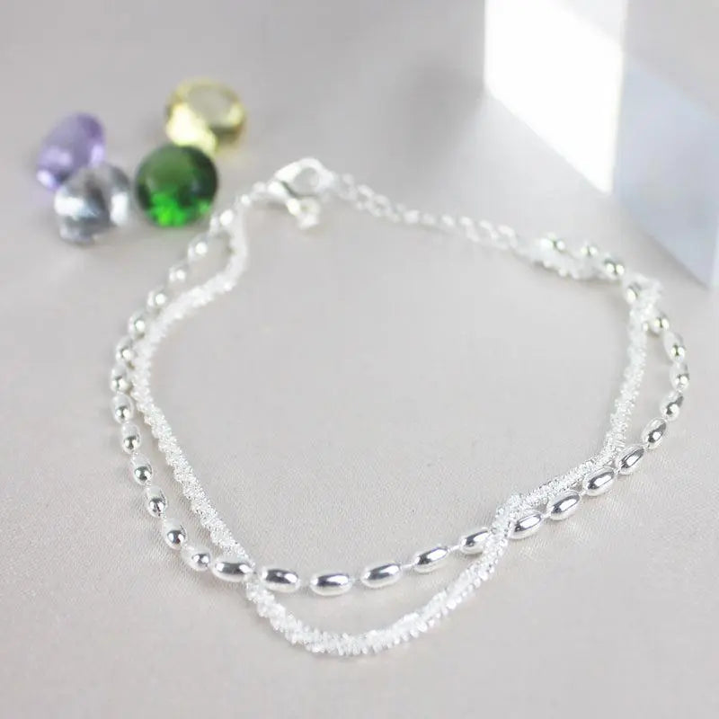 Elegante set di bracciali in argento con zirconi