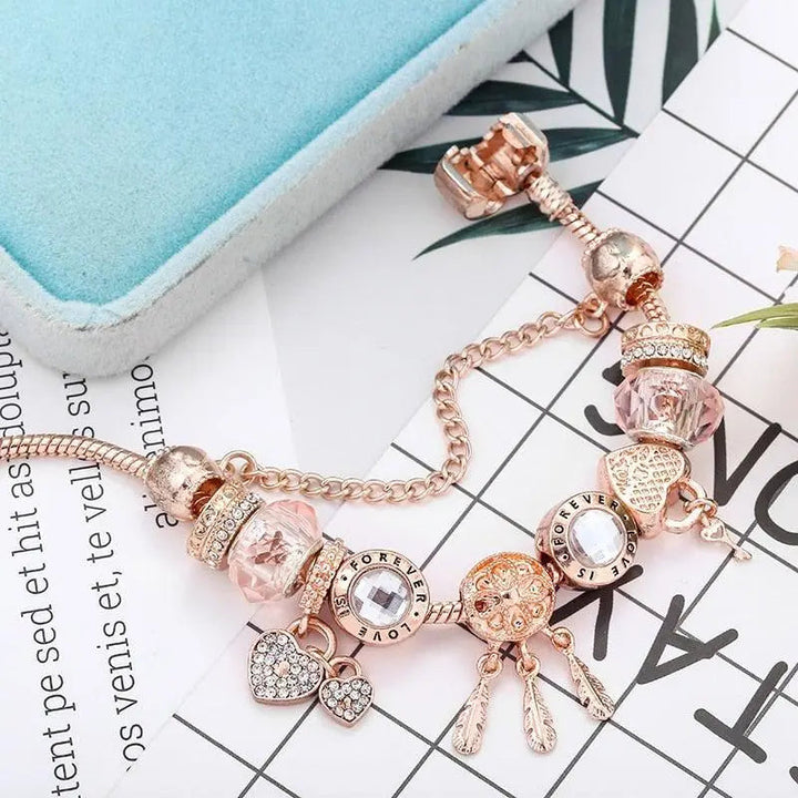 Bracciale acchiappasogni rosa con charms in argento inclusi