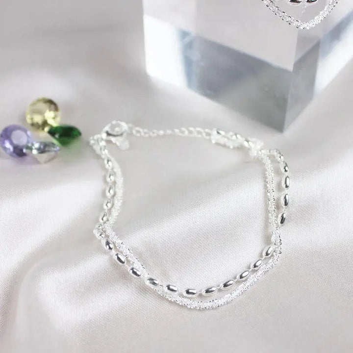 Elegante set di bracciali in argento con zirconi