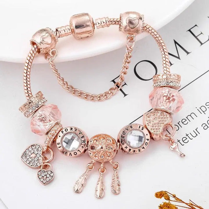 Bracciale acchiappasogni rosa con charms in argento inclusi