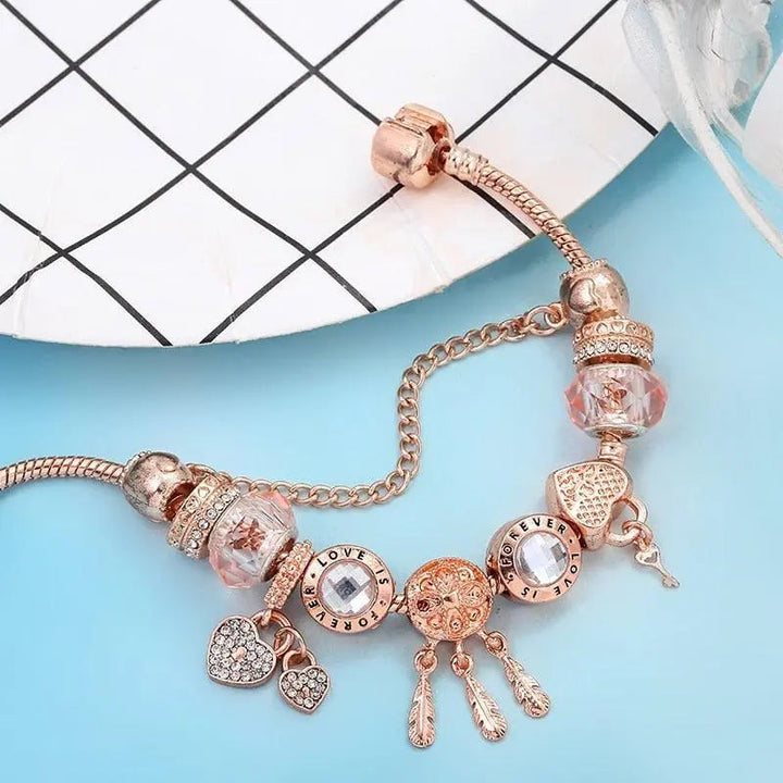 Bracciale acchiappasogni rosa con charms in argento inclusi