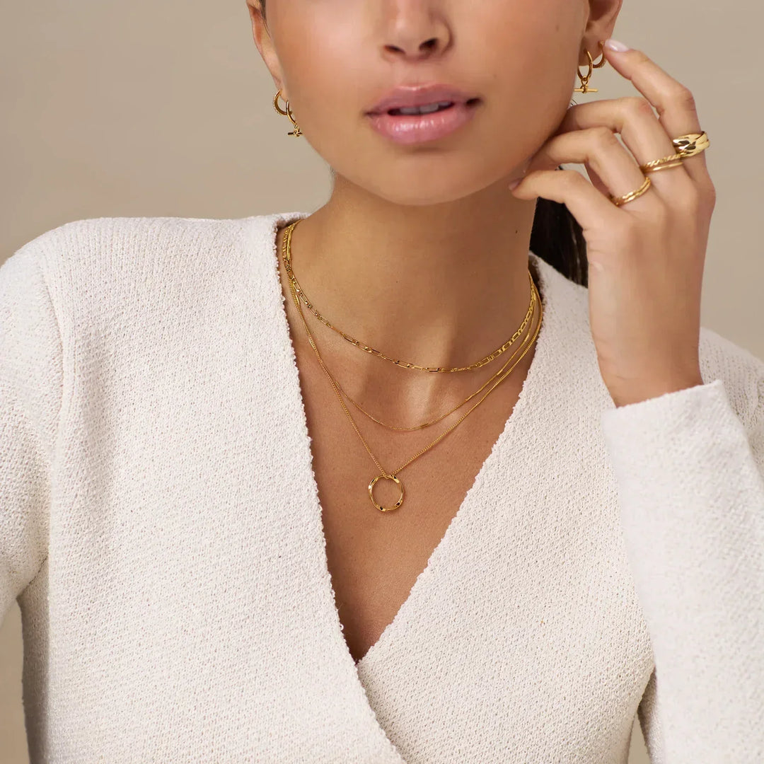 Collier aperto a tre fili in oro