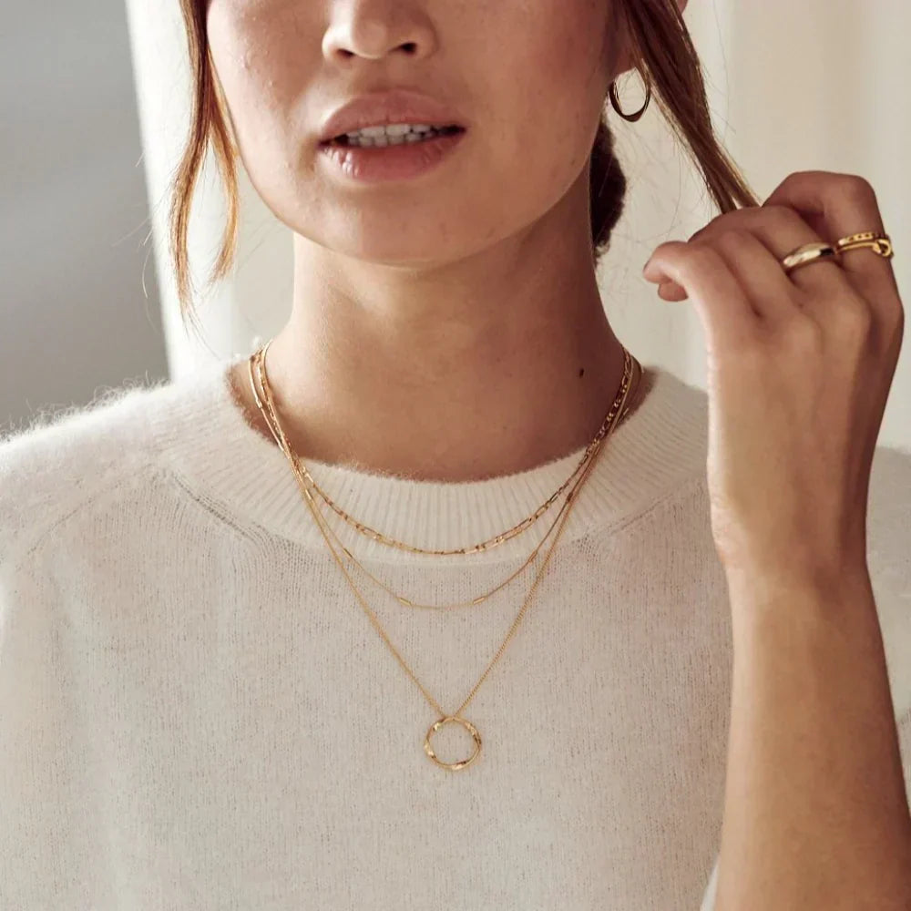Collier aperto a tre fili in oro
