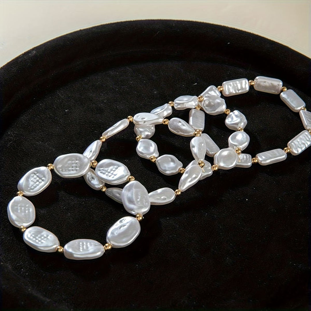 Set di 4 braccialetti con perline