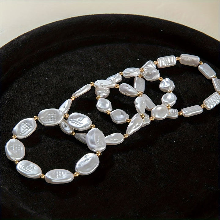 Set di 4 braccialetti con perline