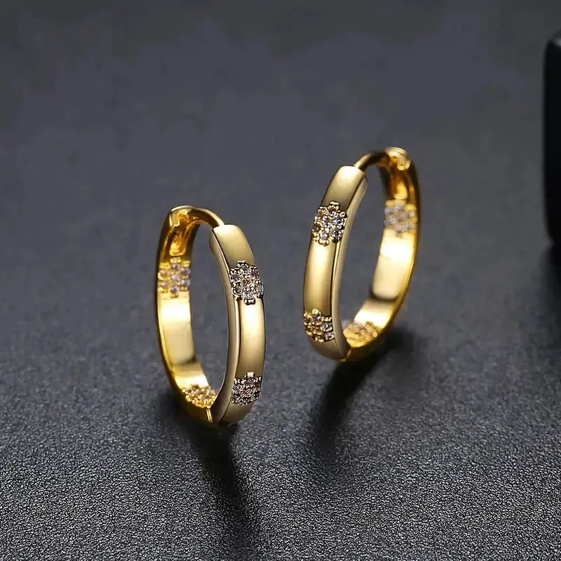 Vintage Ohrringe in Kreisform mit goldener Blume