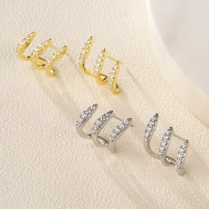 Elegante Ohrringe mit drei Krappen und Strass
