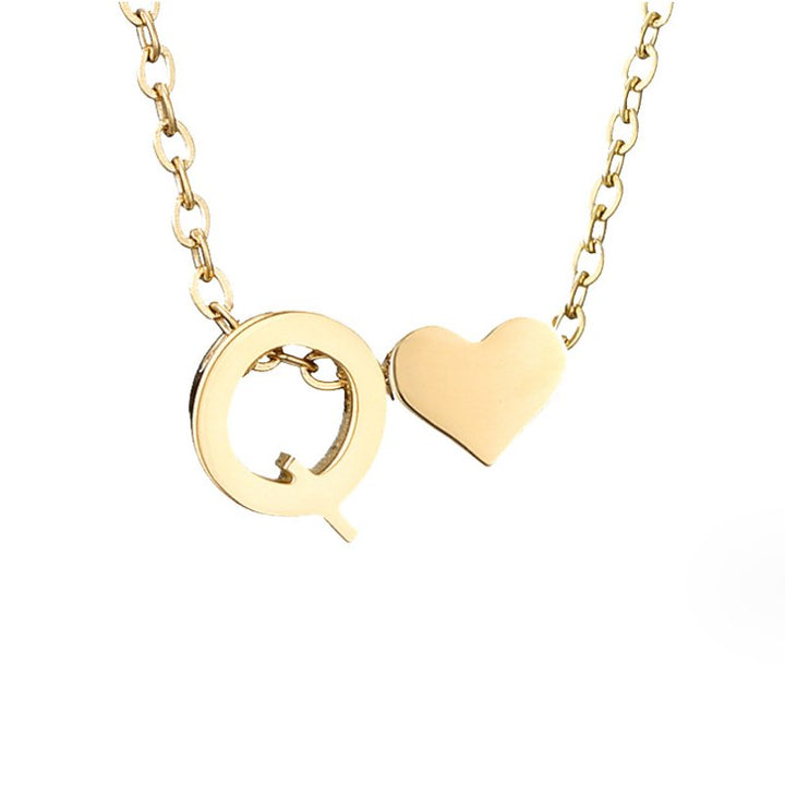 Collana con iniziale senza tempo e ciondolo a cuore