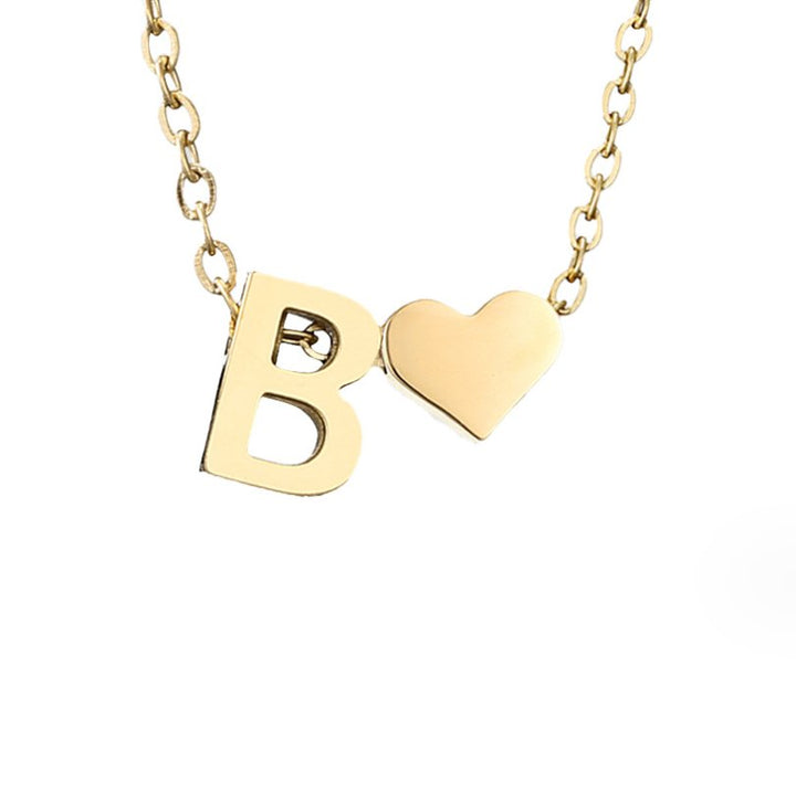 Collana con iniziale senza tempo e ciondolo a cuore